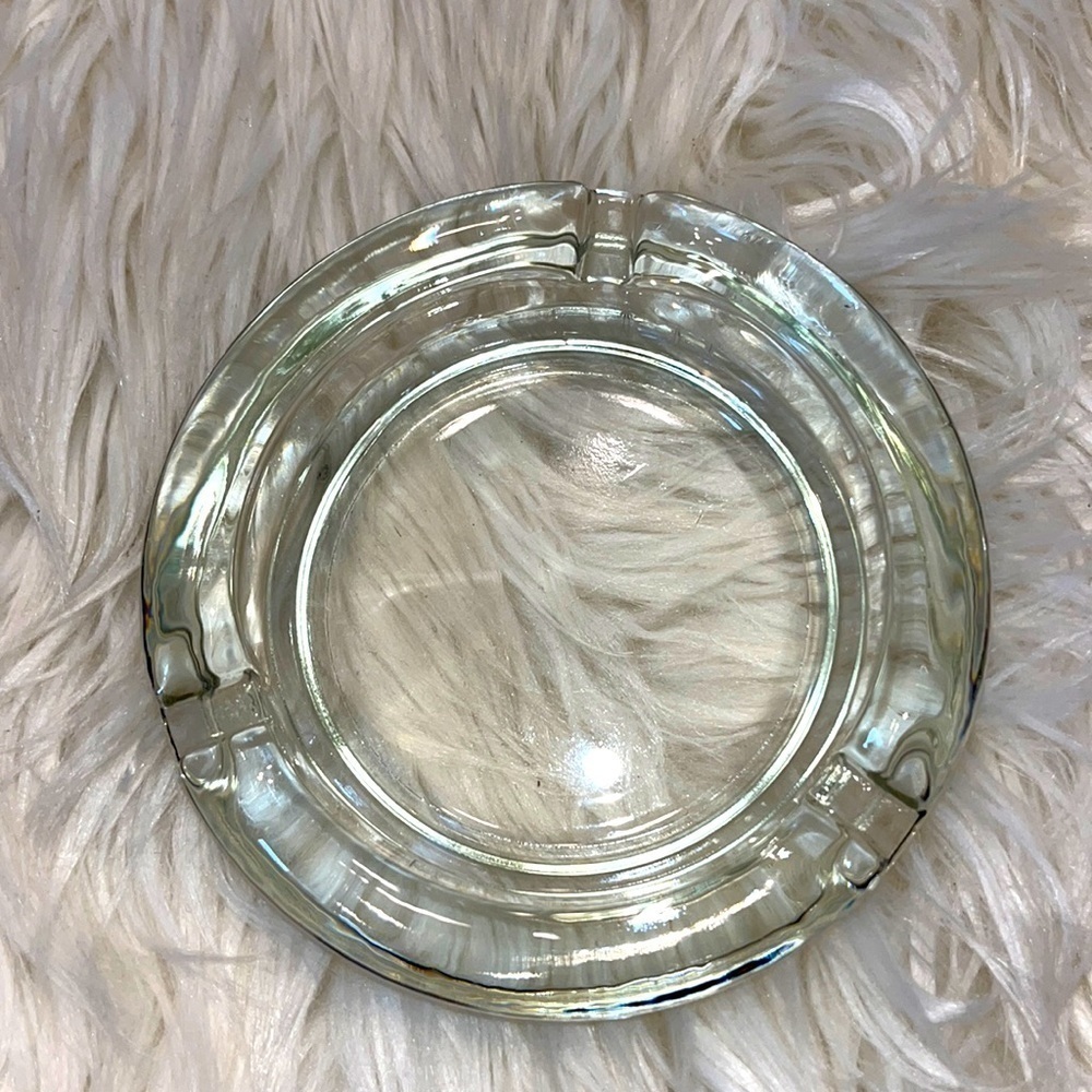 Clear glass ashtray.